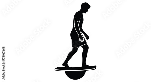 Man balancing on a balance board a striking black silhouette