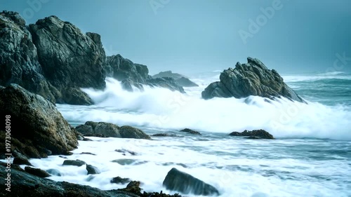Waves crashing against rocky coastline during stormy weather