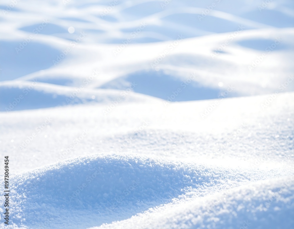 Obraz premium A serene snowy landscape with undulating snow drifts