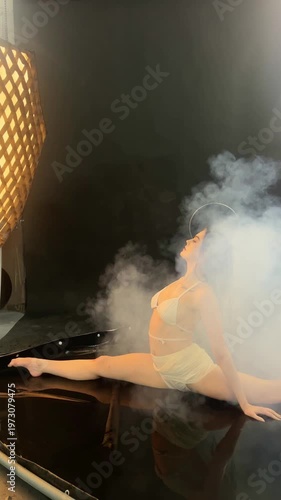 Graceful Angel Performs Splits in Smoke