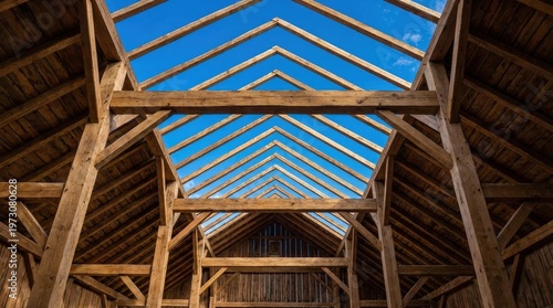 Wooden roof frame with blue sky.