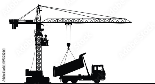 Construction scene a crane operator unloads a dump truck