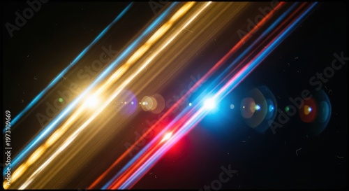 Dynamic long exposure photograph capturing vibrant blue, red, and yellow light trails with prominent lens flares against a dark, abstract background.