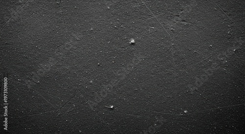 Close-up of a dark, scratched, and dusty textured surface, showing grunge and distressed details.