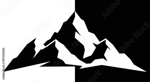 Jagged mountain peaks starkly divided by contrasting black and white halves