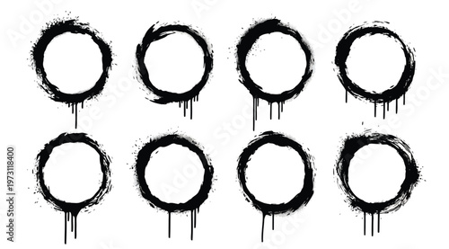 Set of black grunge spray paint circles with drips