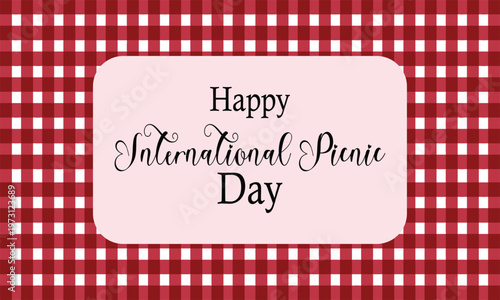 Happy International Picnic Day message on a pale pink rectangle above a classic red and white gingham tablecloth