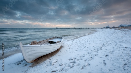 Icy beach scene on Usedom's Baltic coast featuring a white boat, distant pier, and heavy clouds