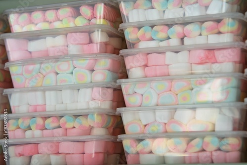 Colourful marshmallow inside clear containers for sale at the shop.