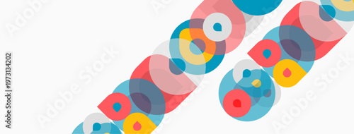 Abstract colorful circles overlap diagonally. Bright hues create dynamic visual pattern. Simple geometric shapes dominate composition.