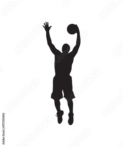 Silhouette of a basketball player jumping to shoot the ball during a game.