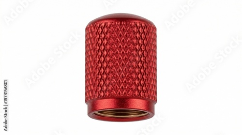 Red anodized aluminum valve stem cap isolate on white background. Sporty automotive tuning accessory for wheel protection and custom vehicle styling. Durable knurled metal part.
