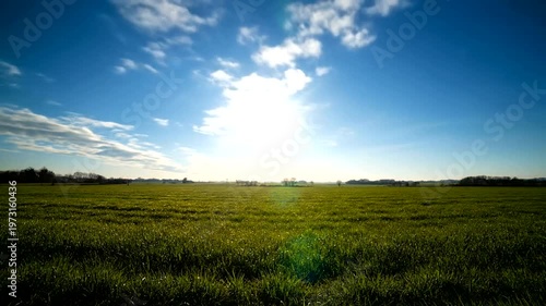 Beautiful Sunset and Sunrise Over Lush Green Field with Dynamic Clouds.