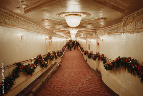 woman gazes at old photograph with warm smile evoking gentle nostalgia