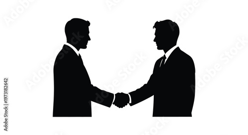 Two business professionals formally shake hands representing a deal or partnership shown as a striking silhouette high quality professional detailed modern