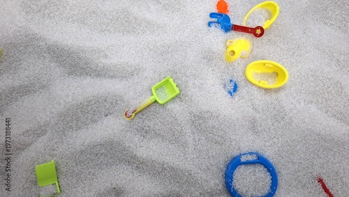 Small Green Shovel on White Sand Pit
