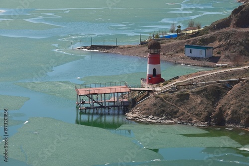 Early spring water surface with ice.  Kapshagay Reservoir. Konaev city.