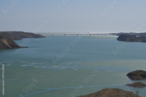 Early spring water surface with ice.  Kapshagay Reservoir. Konaev city.