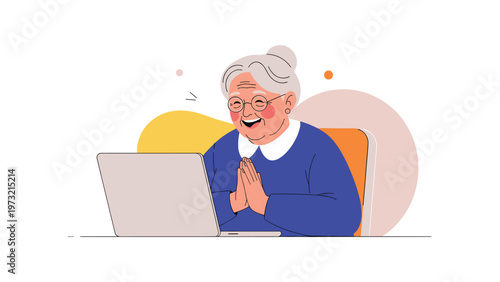 Cheerful senior woman wearing glasses laughs while using a laptop computer for video calling or browsing the internet.