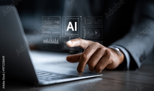 Businessman interacts with holographic AI interface displaying data analytics on a laptop screen