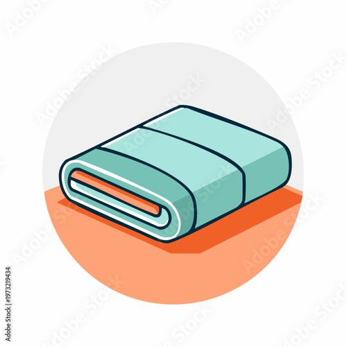 Rolled up green towel on surface.