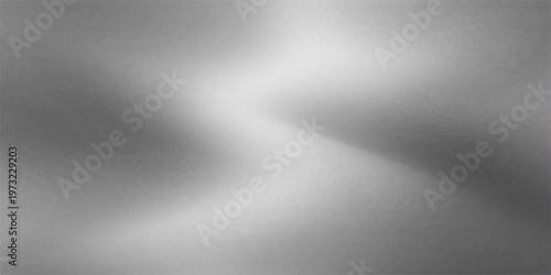 Shiny brushed silver metal texture background with a polished stainless steel surface pattern and light grey chrome reflections for an industrial aluminum backdrop design