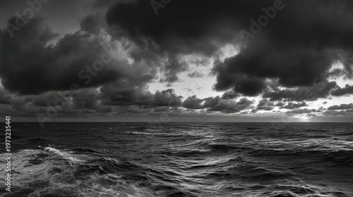 skim. A dramatic seascape at dusk with low, fast-moving clouds over a choppy ocean, an ominous storm approaching. travel magazines.