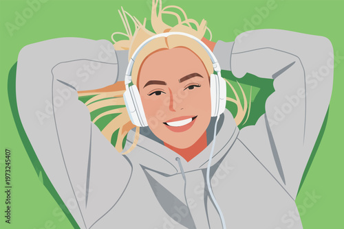 Woman in Hoodie with Headphones Relaxing Outdoors
