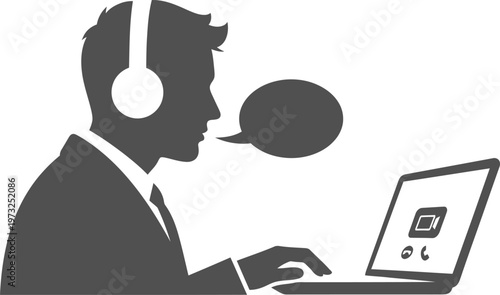 Businessman silhouette with headset conducting video conference on laptop