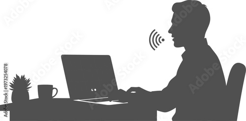 Man using voice recognition on laptop at desk