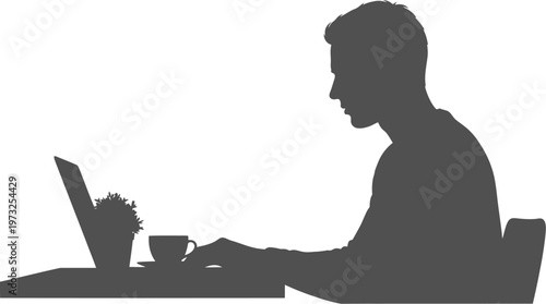 Person sitting at table using laptop with coffee cup and plant