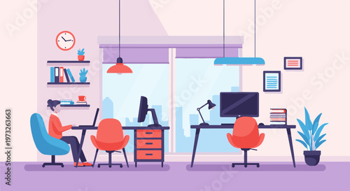 Woman working on laptop in a modern office environment 2.