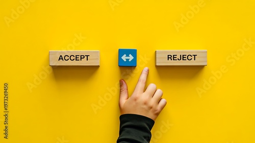 Title:
Hand choosing accept option over reject button on yellow background decision making concept