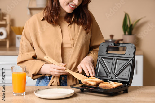 Young woman taking roasted ...