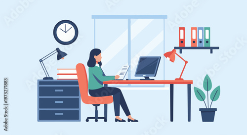 Woman working diligently at her desk in a modern office setting.