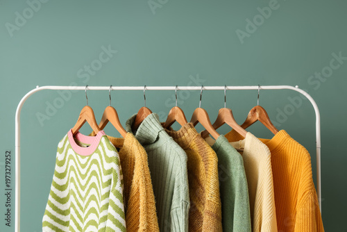 Rack with knitted sweaters ...