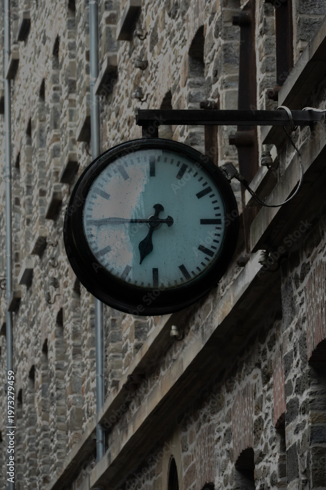 Fototapeta premium “Outdoor Wall Clock on Historic Stone Building