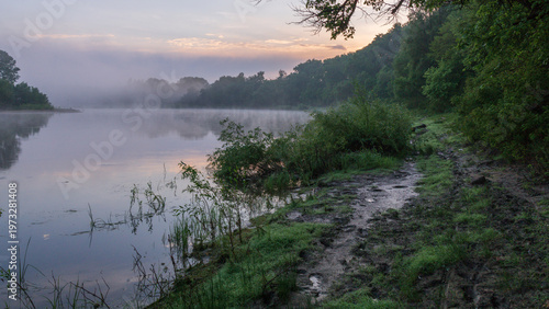 Tablou pe pânză A misty sunrise over the river