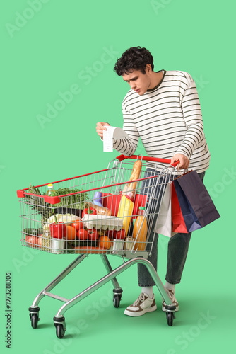 Young man with shopping car...