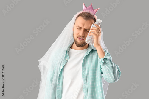 Young man in bridal veil pu...