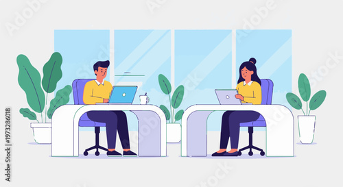 Two colleagues working on laptops at their desks in an office.