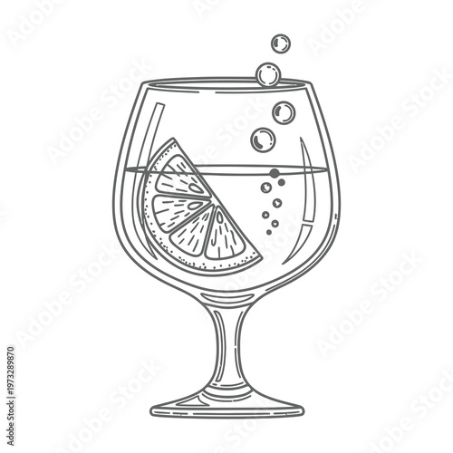 Gin and tonic cocktail with lime wedge in wine glass