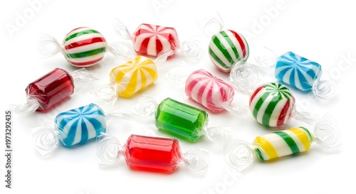 Assorted colorful hard and chewy candy selection on a neutral background