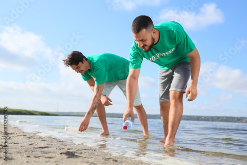 Male volunteers cleaning up...