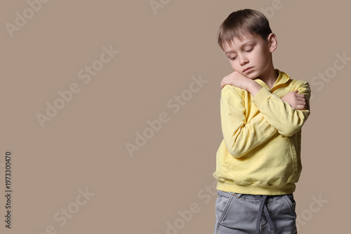 Sad little boy with autisti...