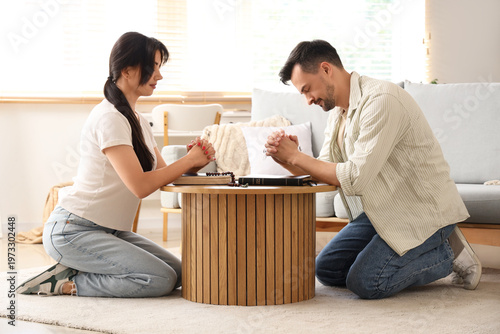 Religious couple praying be...