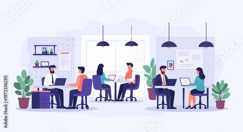 Colleagues collaborating and working on laptops in a modern office environment with plants