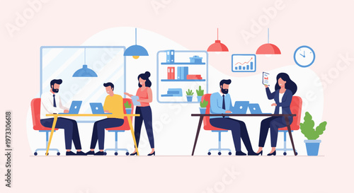 Colleagues collaborate and work on laptops in a modern office setting