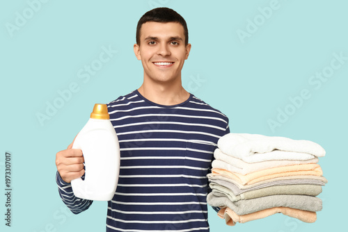 Young man with bottle of de...