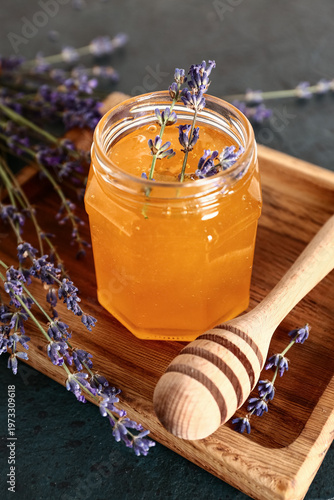 Wooden board with jar of sw...